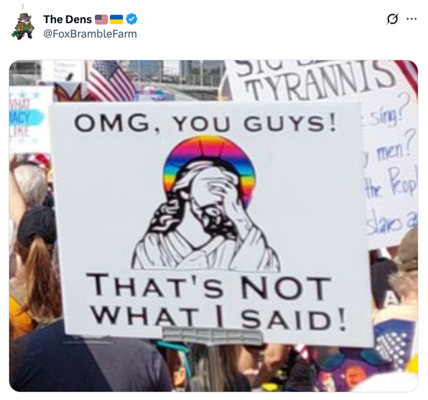 Protestskilt med et bilde av Jesus som ansiktspalmer, teksten lyder: 