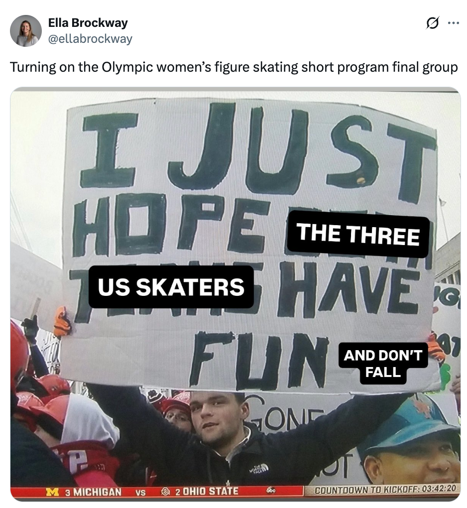 Person som holder et skilt ved et kunstløpsbegivenhet og leser: